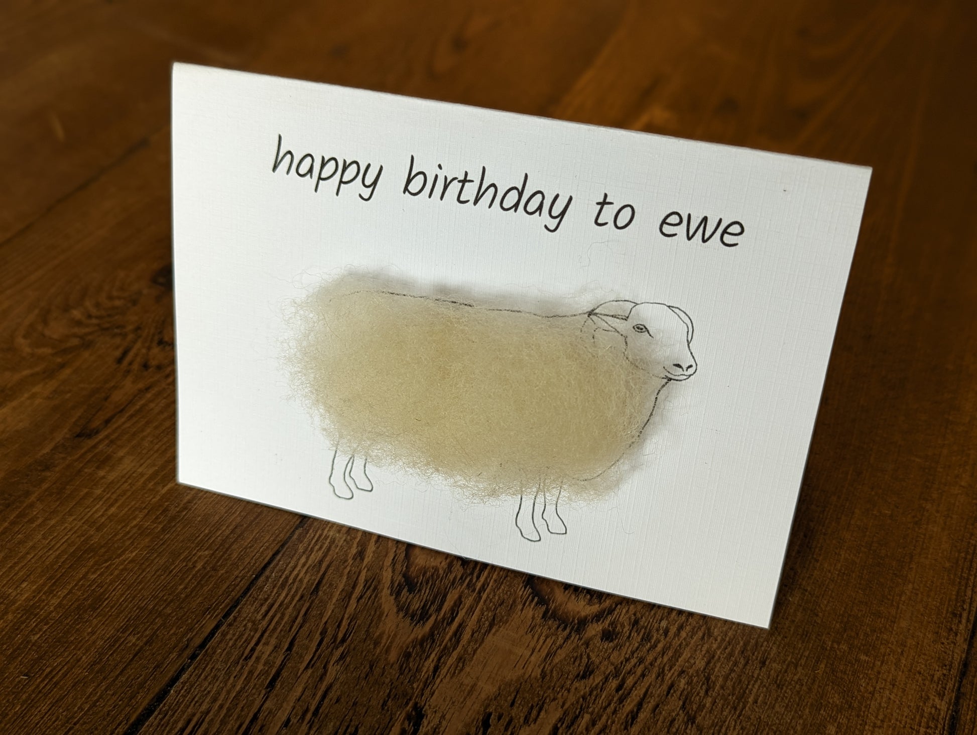 Handmade happy birthday greetings card. Woolly sheep with Whitefaced Woodland wool. Handcrafted in Yorkshire.